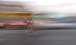 Biking through jammed traffic. AND, panning a shot and not caring if it's perfect or not because you think this ghost biker is the coolest thing on earth...